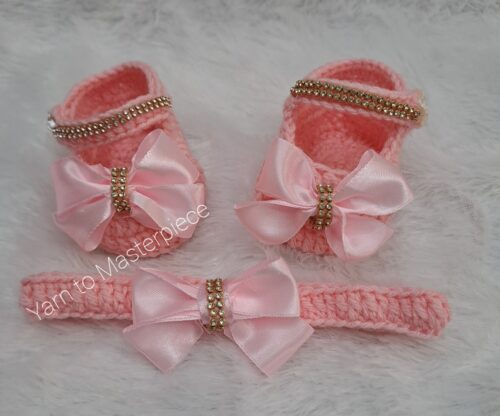 Crochet handmade baby girl shoes and headband set.