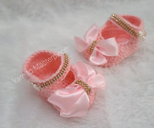 Crochet handmade baby girl shoes and headband set.