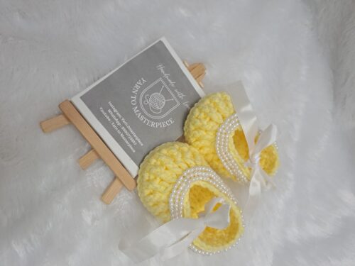Crochet baby girl booties with beads.