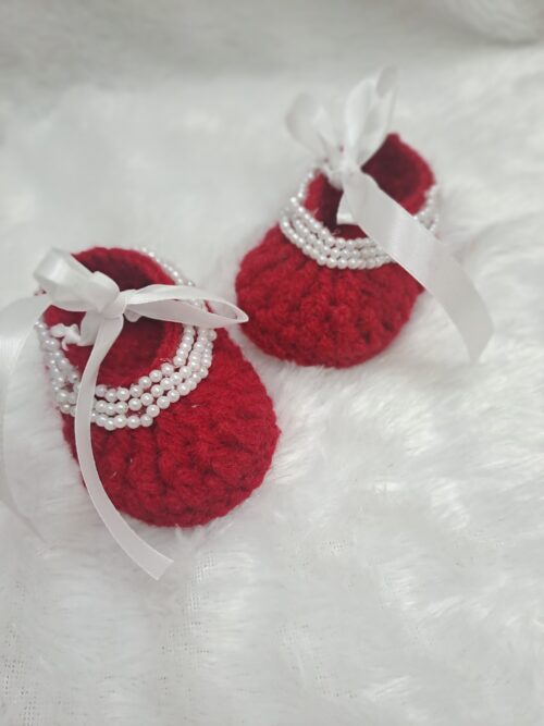 Crochet baby girl booties with beads.