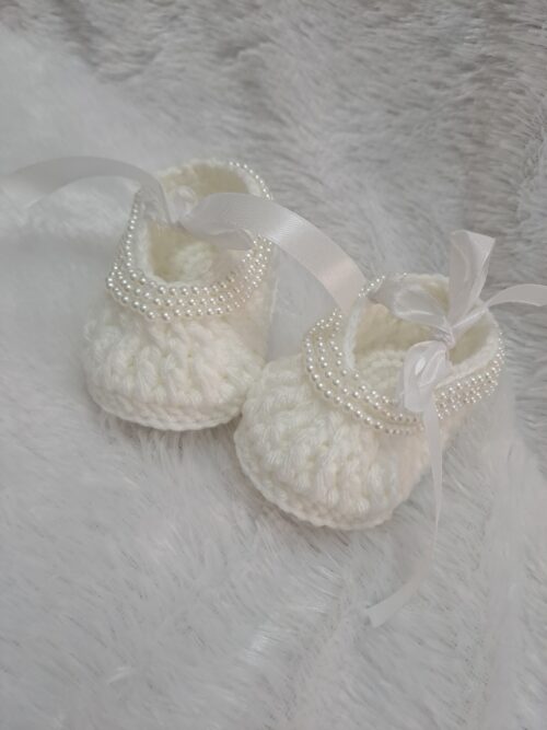 Crochet baby girl booties with beads.