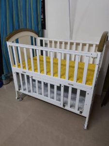 Wooden Baby Crib with Adjustable Side Rail and Storage