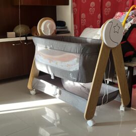 Preowned R for rabbit branded baby cradle with automatic swing, musical lullabies and a bed light