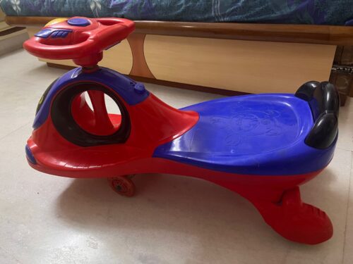 Swing Car for Kids – Blue & Red | Gently Used | Smooth Ride & Fun Playtime