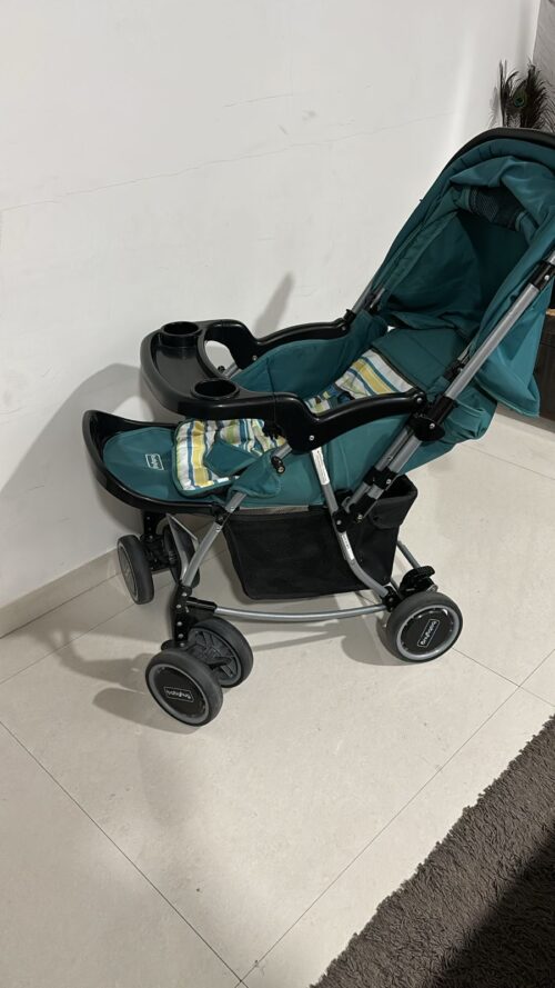 Baby hug 2 in 1 rocker and roll stroller cum rocker green